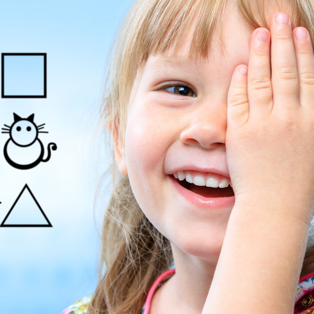 Child hold one eye doing eye exam with shapes (blue sky background)
