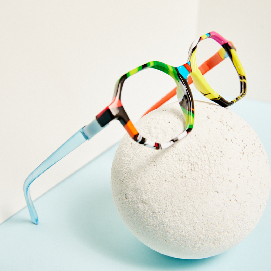 MEsquad colorful and durable glasses resting on styrofoam white ball